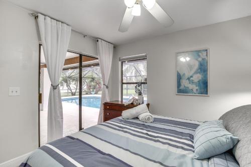 a bedroom with a bed and a large window at Convenient Wellington Home Pets Welcome! in Wellington