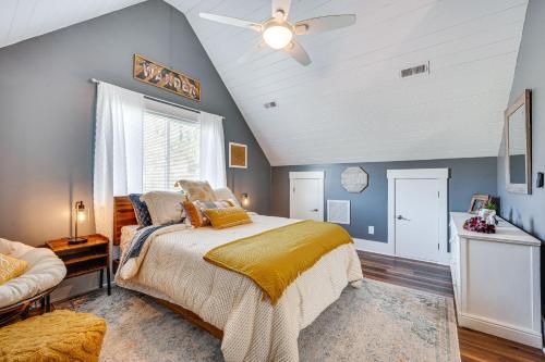 a bedroom with a bed and a ceiling fan at Lakefront New London Retreat with Dock and Hot Tub! in New London