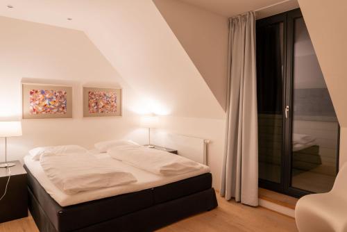 Postel nebo postele na pokoji v ubytování Strandlust 21A Wohnung