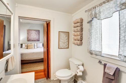 a bathroom with a toilet and a bedroom at Charming Hot Springs Home Less Than 2 Mi to Bathhouse Row! in Hot Springs