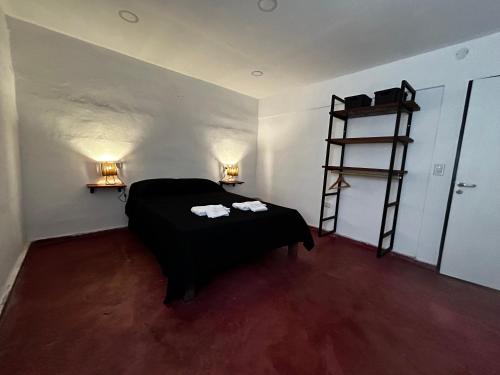 Postel nebo postele na pokoji v ubytování Departamentos MarCor