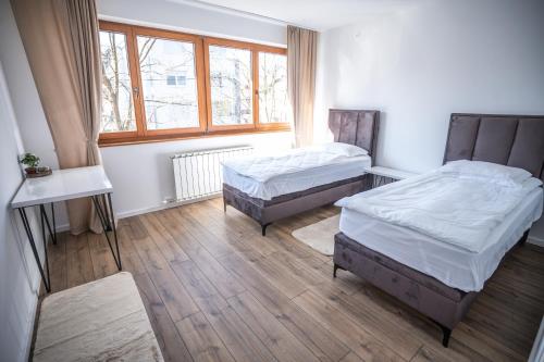 En eller flere senge i et værelse på E&A Apartman Ajla i Amir