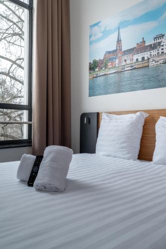 Katil atau katil-katil dalam bilik di easyHotel Maastricht City Centre