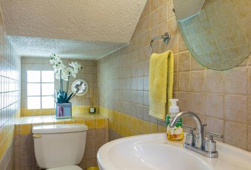 a bathroom with a toilet and a sink at Beach House-Villa Taina, Boqueron Deposit Required in Cabo Rojo