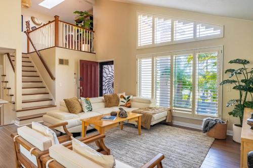 a living room with a couch and a table at Resort style back yard heated pool and spa in Encinitas