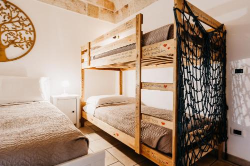 Cama o camas de una habitación en Le Contrade via Roma