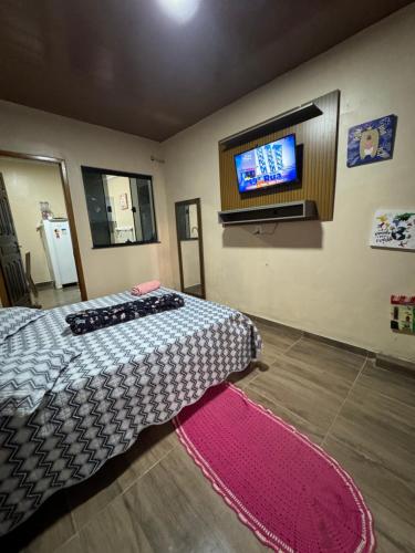 Postel nebo postele na pokoji v ubytování Espaço inteiro - Quarto e cozinha