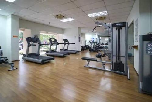 a gym with several tread machines in a room at Seri Maya -Lrt setiawangsa - Master Room with shared unit in Kuala Lumpur