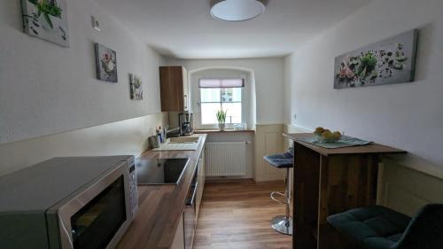 a kitchen with a sink and a counter top at Ferienwohnung Angie in Vogtsburg