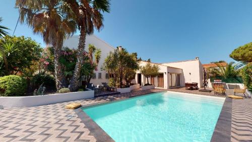 a swimming pool in the backyard of a house at Résidence Villa Branda in Calvi
