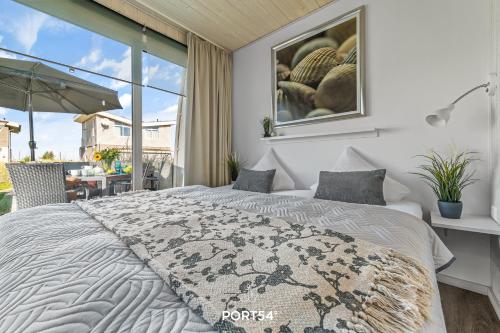 Postel nebo postele na pokoji v ubytování Ferienhaus Strandperle Marina Wendtorf