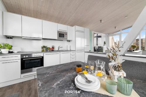 Køkken eller tekøkken på Ferienhaus Ahoi Marina Wendtorf