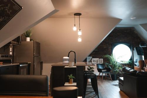 an attic kitchen with a table and some chairs at Trumbull 300 in Detroit