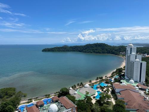 an aerial view of a resort and the beach at 10G Perfect 2 Bedroom with Ocean and Jungle Views in ArraijÃ¡n