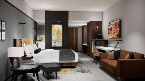 a hotel room with a bed and a living room at Black Desert Resort in Ivins
