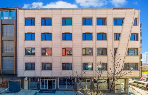 an office building with blue windows at Dem İstanbul Airport Hotel in Istanbul