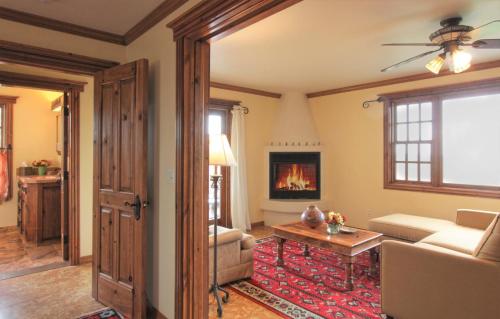 a living room with a couch and a fireplace at Blue Lake Ranch in Hesperus