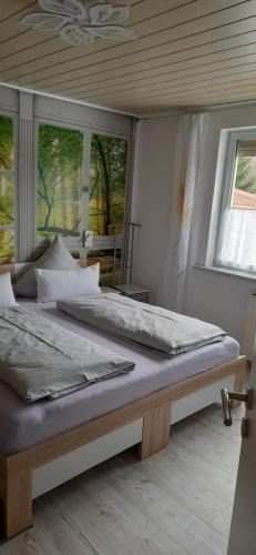 מיטה או מיטות בחדר ב-Der Frühe Vogel