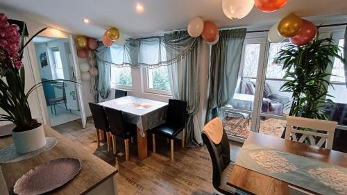 a dining room with a table and chairs at Ubytování v soukromí Karin in Ludvíkov