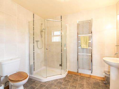 a bathroom with a shower and a toilet and a sink at 2 Bed in Edzell CA300 in Edzell