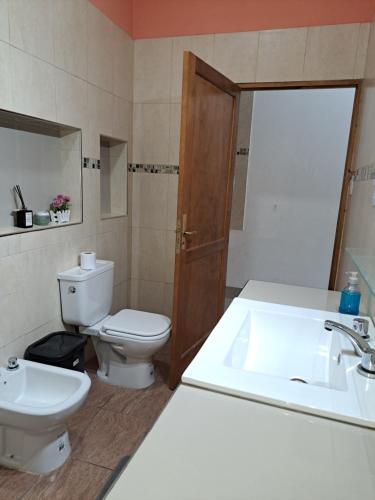 a bathroom with a sink and a toilet at Finca La Fortaleza zanjon in Santiago del Estero