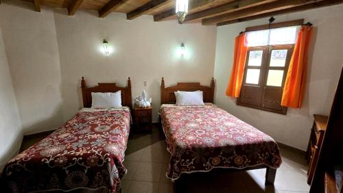 Postel nebo postele na pokoji v ubytování Hotel Plaza Baratillo
