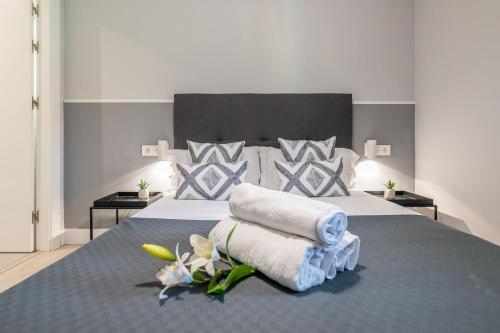 En eller flere senge i et værelse på XPCE Rodeo Beach - Puerto Banus