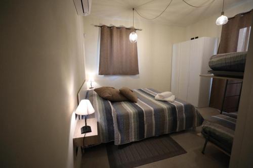 a bedroom with a bed with two pillows on it at Il Fienile in Magliano Alpi