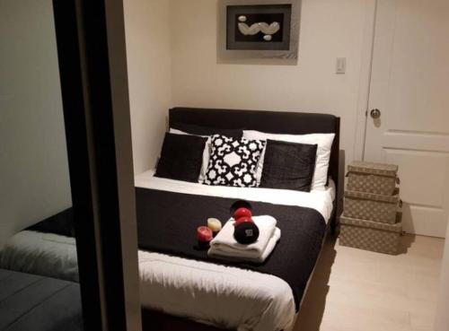 a bedroom with a bed with a stuffed animal on it at Penthouse Apartment in Paranaque in Manila