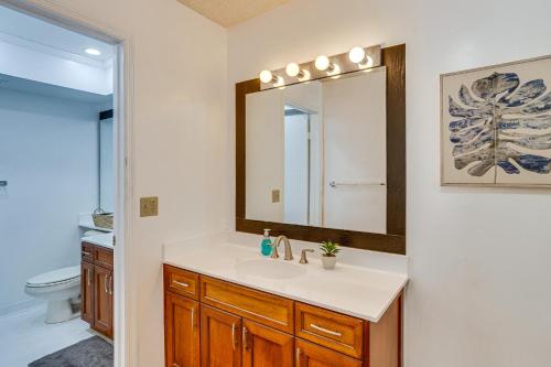 a bathroom with a sink and a mirror at Condo in PGA National Resort w/ Pool & Spa! in Palm Beach Gardens