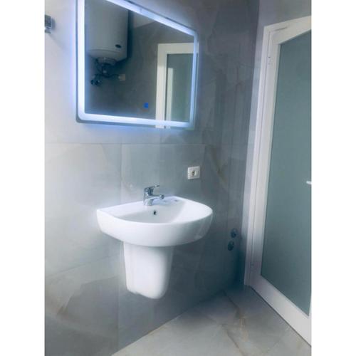 a bathroom with a sink and a mirror at Real Resort Albania in Fushë-Draç