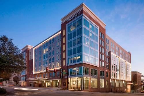 a large building on a street with a traffic light at Residence Inn by Marriott Greenville Downtown in Greenville