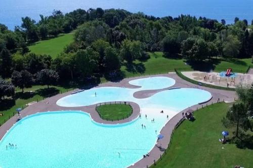 an aerial view of a river with people swimming in it at Stylish 2BR: w/free parking & streaming! in Pickering