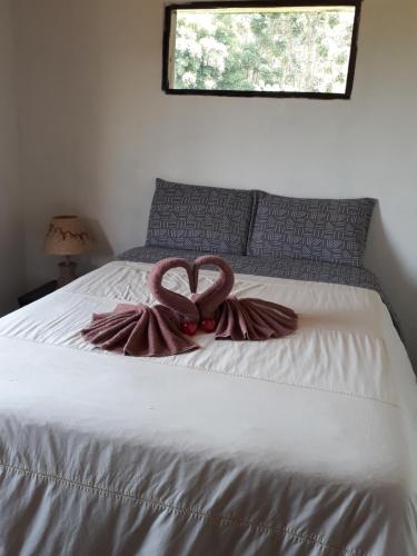 Ένα ή περισσότερα κρεβάτια σε δωμάτιο στο Casa Beija flor