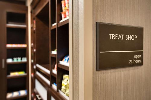 a treat shop sign on the door of a store at Hampton Inn Denville-Rockaway-Parsippany in Denville