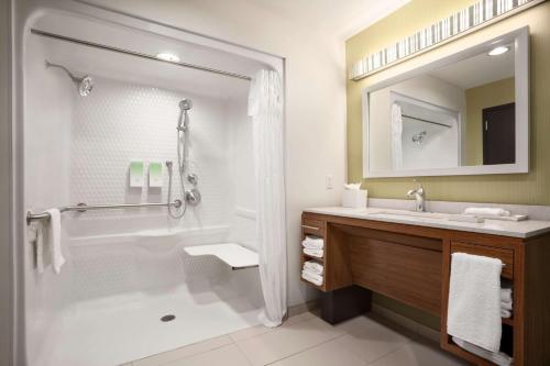 a bathroom with a tub and a sink and a shower at Home2 Suites by Hilton Rahway in Rahway