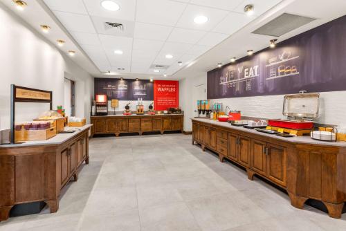 a fast food restaurant with wooden counters in a room at Hampton Inn & Suites Fairbanks in Fairbanks