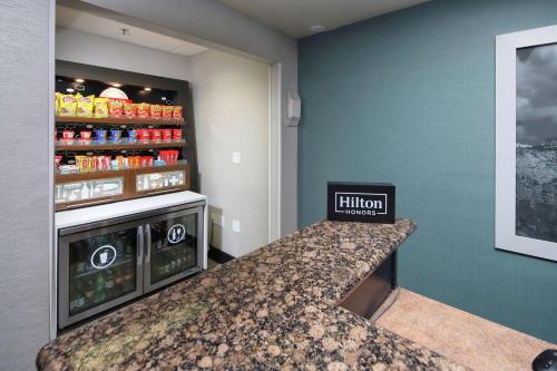 a kitchen with a counter with a drink cooler at Hampton Inn Sierra Vista in Sierra Vista