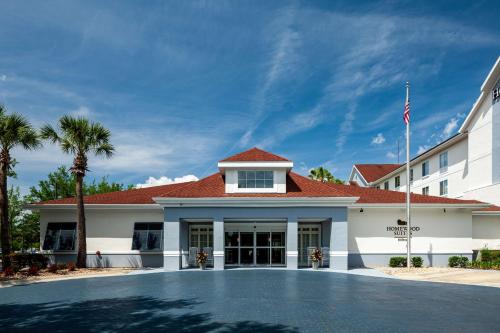 a building with a basketball court in front of it at Homewood Suites by Hilton Gainesville in Gainesville