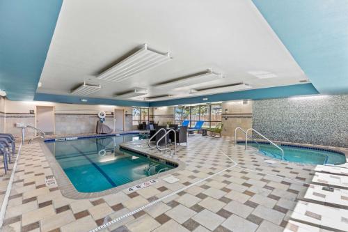 a pool in a hotel room with a swimming pool at Hampton Inn & Suites Greeley in Greeley