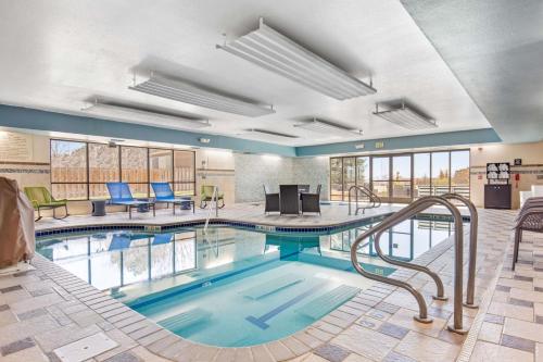 a pool with a slide in a hotel room at Hampton Inn & Suites Greeley in Greeley