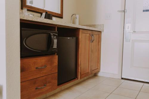 a kitchen with a sink and a microwave at Hampton Inn & Suites Green River in Green River