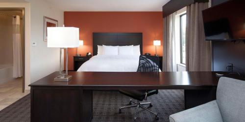 a hotel room with a bed and a desk with a desk at Hampton Inn & Suites Seneca-Clemson Area in Seneca