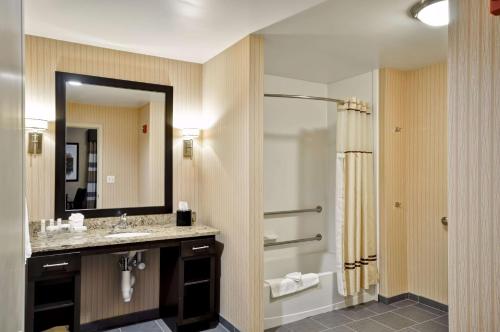 a bathroom with a sink and a shower and a mirror at Homewood Suites by Hilton Hartford / Southington CT in Southington