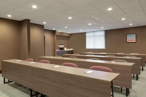 a conference room with tables and chairs in it at Hampton Inn & Suites Houston-Cypress Station in Westfield