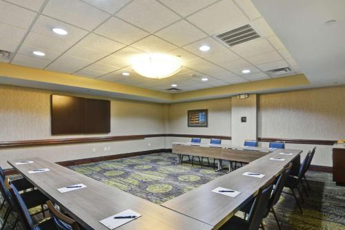 a conference room with tables and chairs and a podium at Homewood Suites by Hilton Houston Near the Galleria in Houston