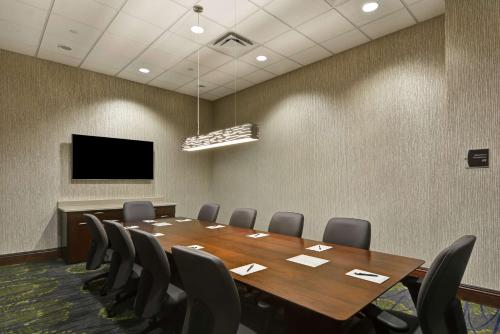 a conference room with a wooden table and chairs at Homewood Suites by Hilton Houston Near the Galleria in Houston