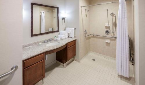 a bathroom with a sink and a shower at Homewood Suites by Hilton Houston Stafford Sugar Land in Stafford