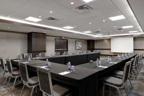 a conference room with a long table and chairs at Embassy Suites by Hilton Niagara Falls/ Fallsview in Niagara Falls
