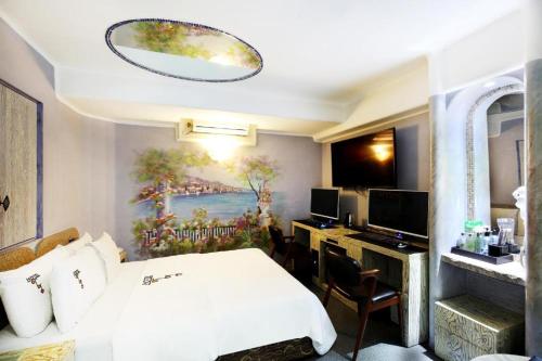 a hotel room with a bed and a desk at Amant Hotel in Goyang